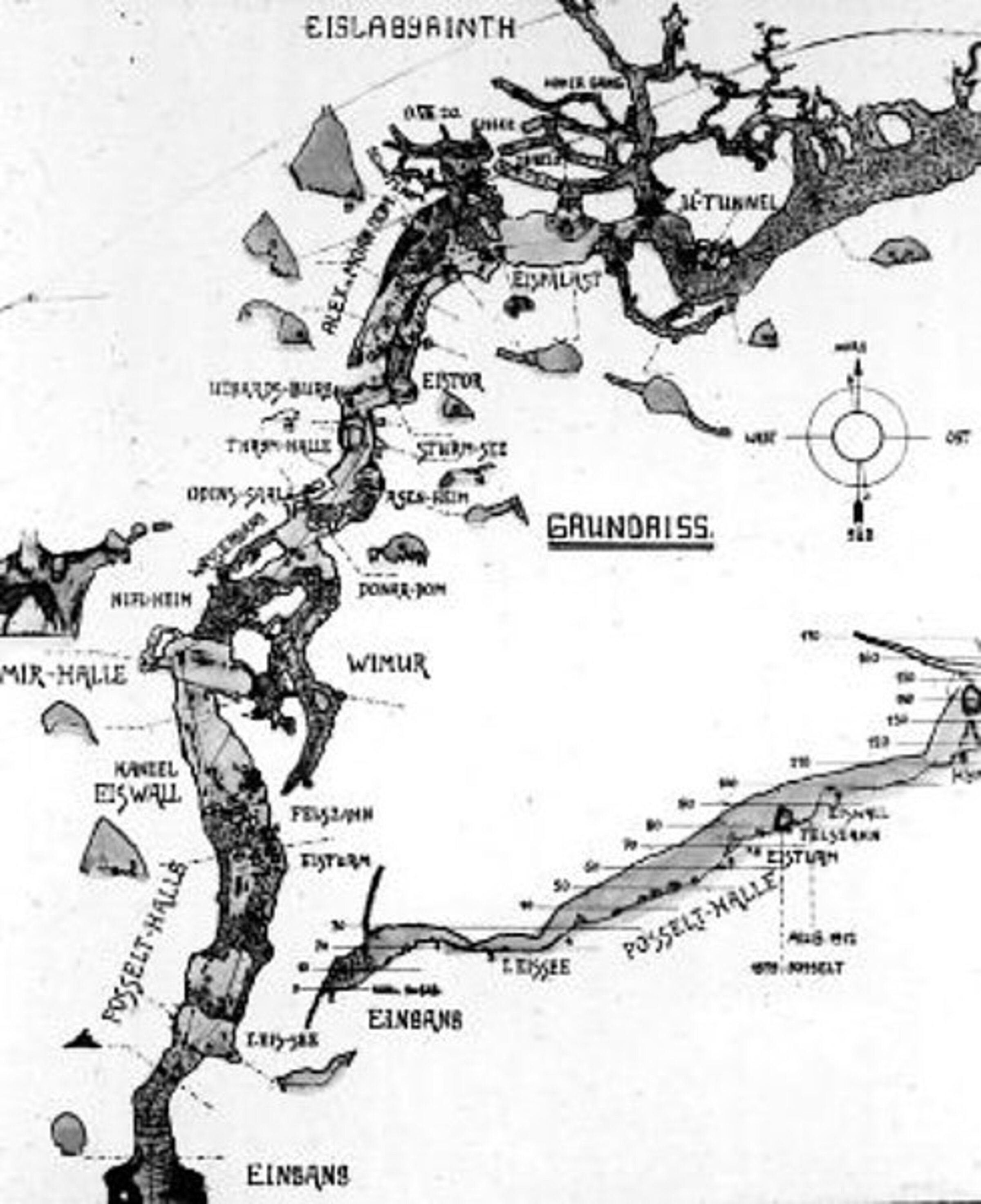 Black and white map of a cave system with detailed labeling of sections, passages and prominent rock formations. A compass provides orientation, while German-language designations illustrate the structure and subdivision of the cave.